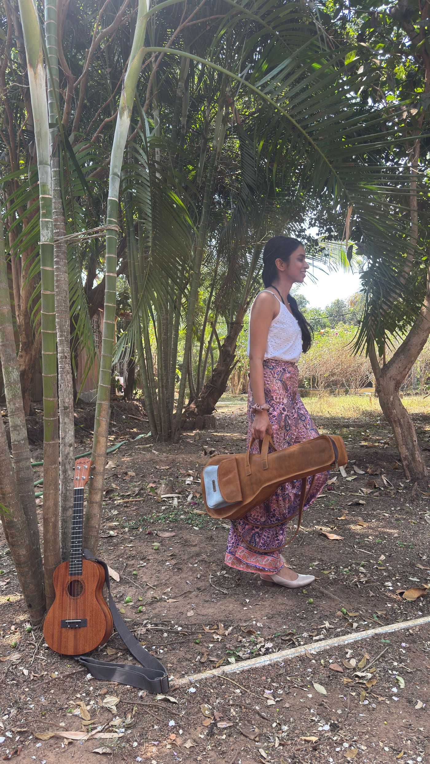 A Kailo artisan finishing a handcrafted leather instrument bag